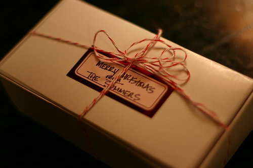Peppermint Bark gift box wrapped with red twine and addressed to friends