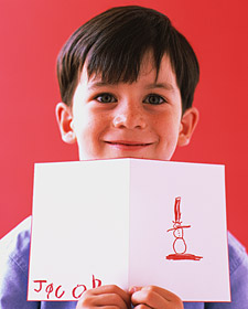Boy holding a handmade holiday card