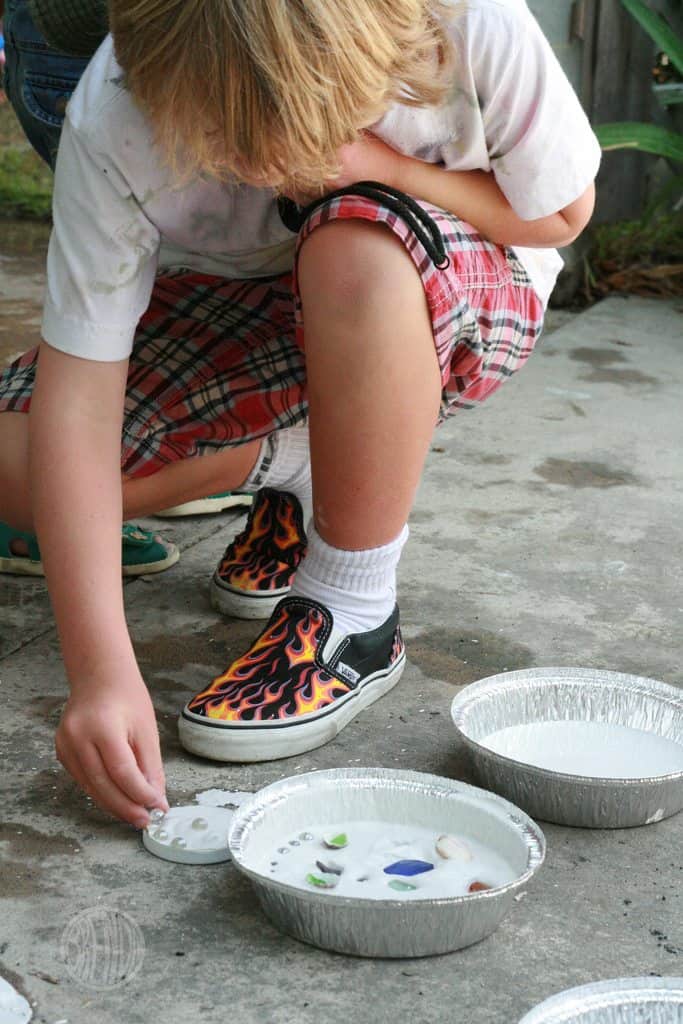 Adding seashells to make mosaic 