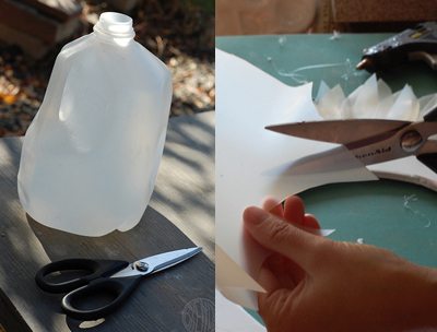 Empty milk carton and scissors on a table 