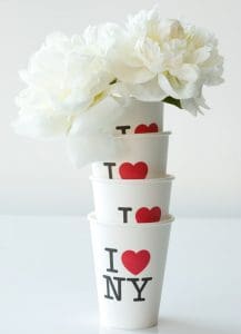 white flowers inside stacked i heart new york coffee cups