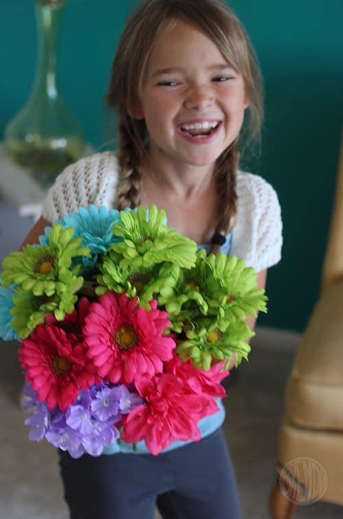 A child holding a bouquet of flowers 