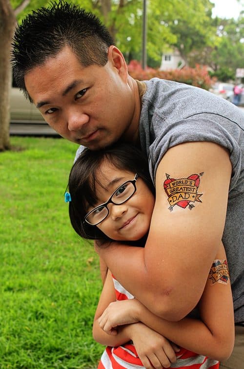 black and grey portrait tattoo of father and child by Killian Moon:  TattooNOW