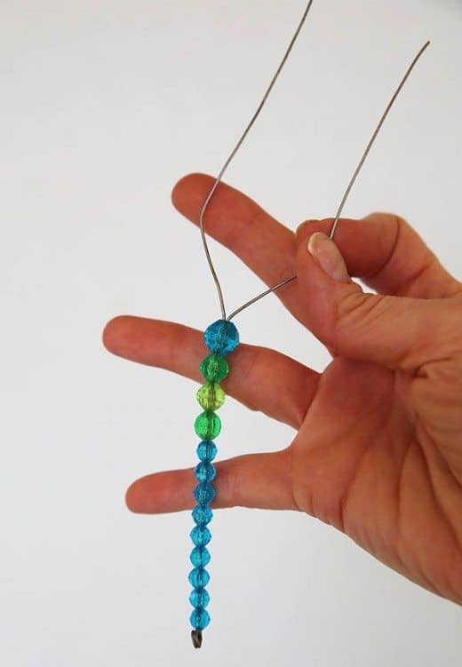 step two for beaded butterfly craft (add beads to wire)