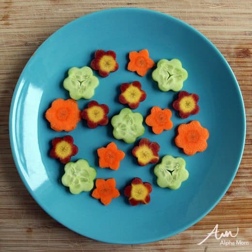 Flower shaped veggies arranged on a plate 