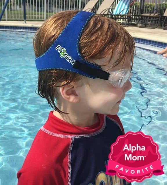 a young boy in a pool wearing Frogglez Swim Goggles