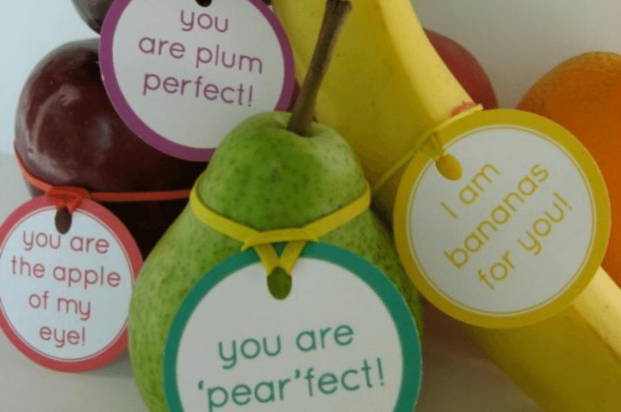 Encouraging messages printed on paper and tied to fruit with a rubber band
