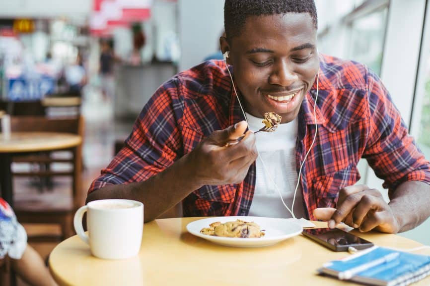 Young man eating at a table