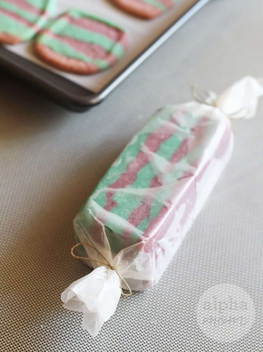 striped pink and turquoise "mermaid" icebox cookie dough wrapped for freezing 