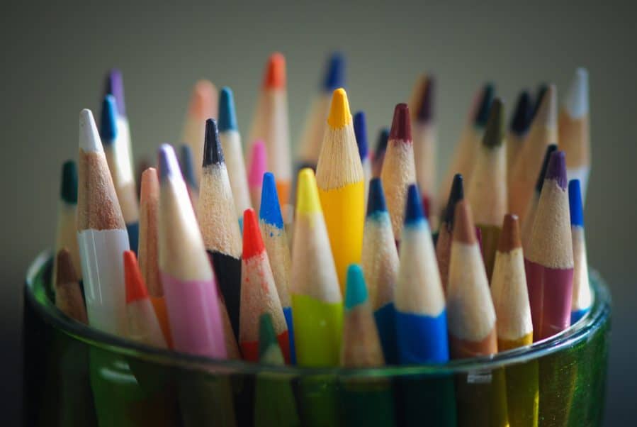 Color pencils in a plastic container