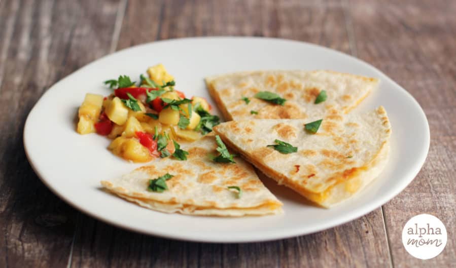 Cheese quesadilla on a plated with mango salsa