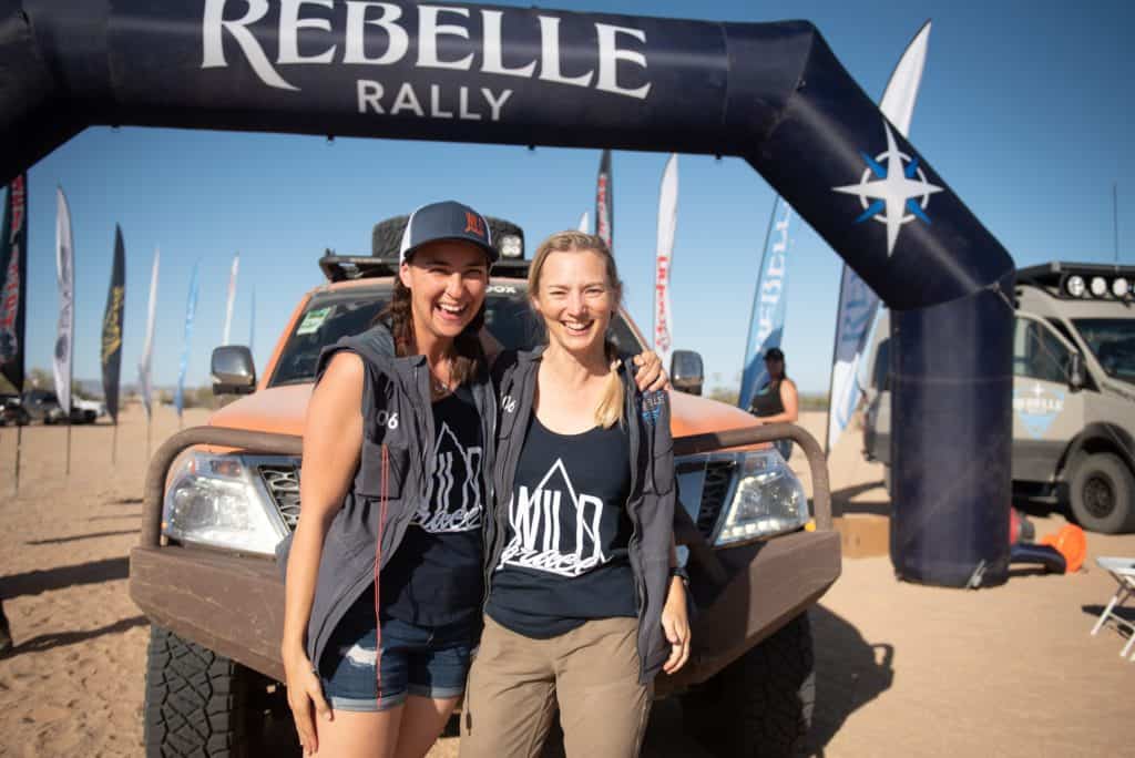 photo of Sedona and her driving partner Lyn Woodward in front of Rebelle Rally sign