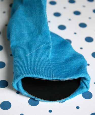 turning black cardboard into mouth for blue Cookie Monster sock puppet