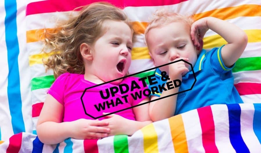 young sleepy sister and brother sharing a bed with striped sheets with the overlay of words "Updated & What Worked"