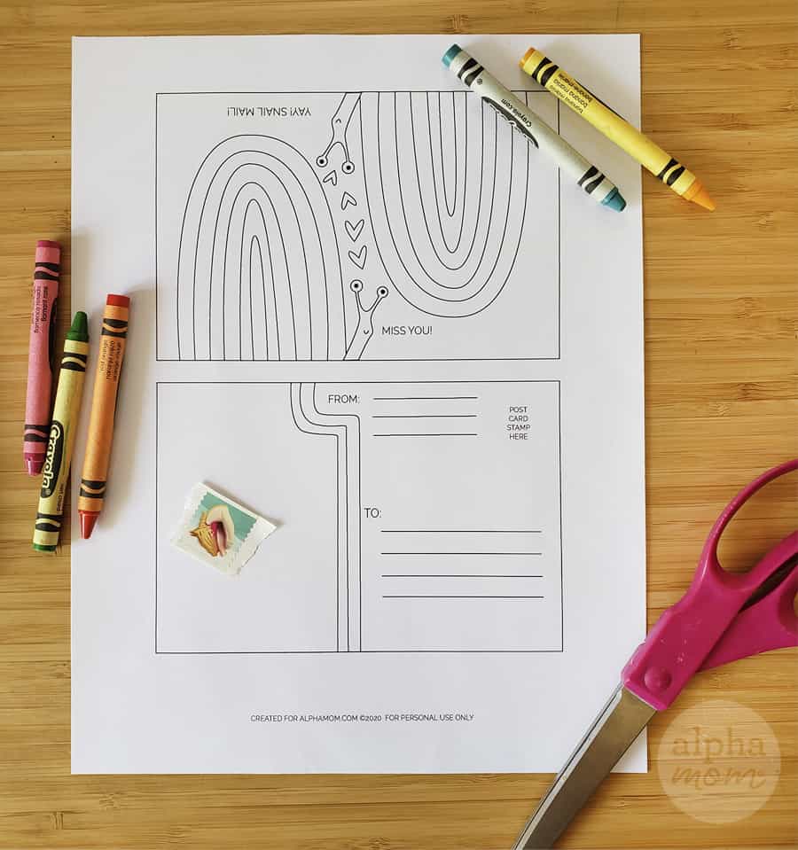 blank snail mail postcard printable coloring sheet with crayons and scissors on table 