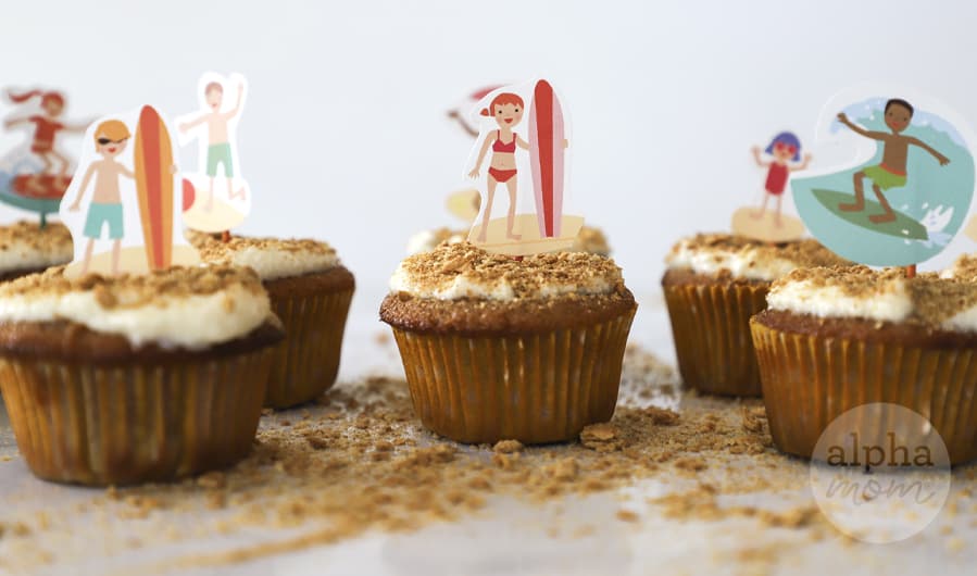 Close-up of beach-themed cupcakes with crumbled graham crackers on the counter