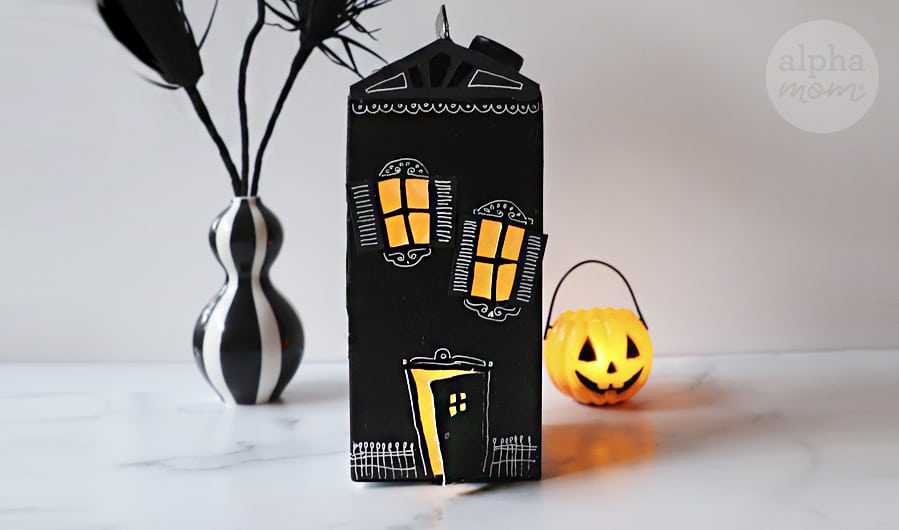 photo of a miniature haunted house decoration for Halloween made from an upcycled milk carton