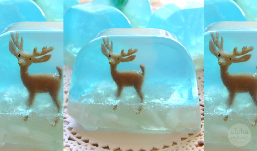 Triptych of handmade snowglobe soap with toy reindeer inside