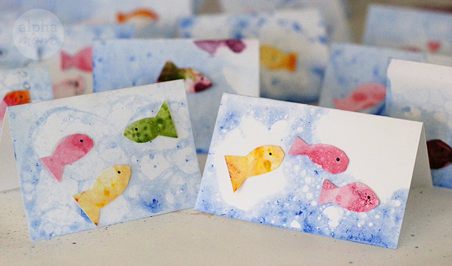 many handmade greeting cards of bubble fish art neatly lined up in a few rows